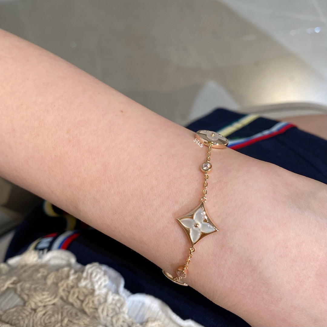 [Triumph Jewelry]STAR AND SUN 4 MOTIF WHITE MOP PINK GOLD BRACELET
